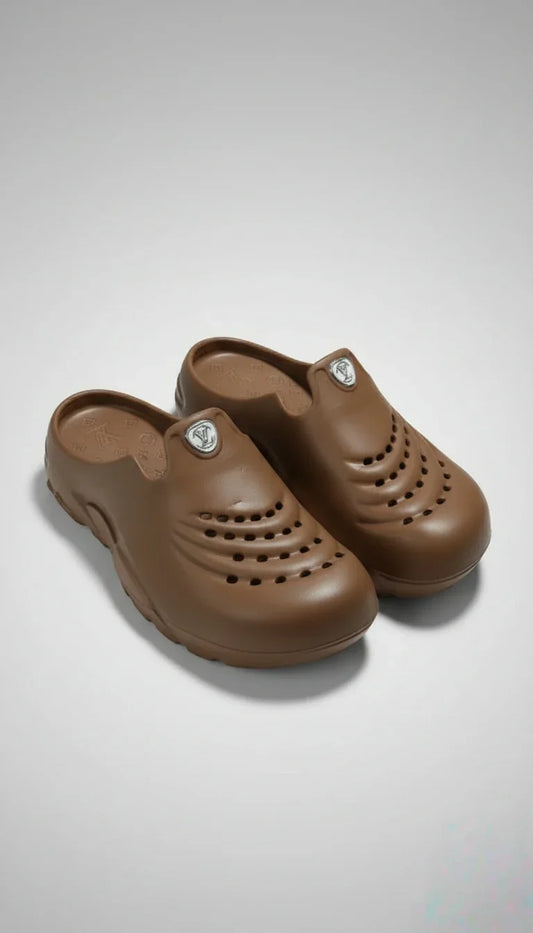 Pair of brown clogs on a light gray background