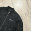 Black Burberry jacket on a marble surface