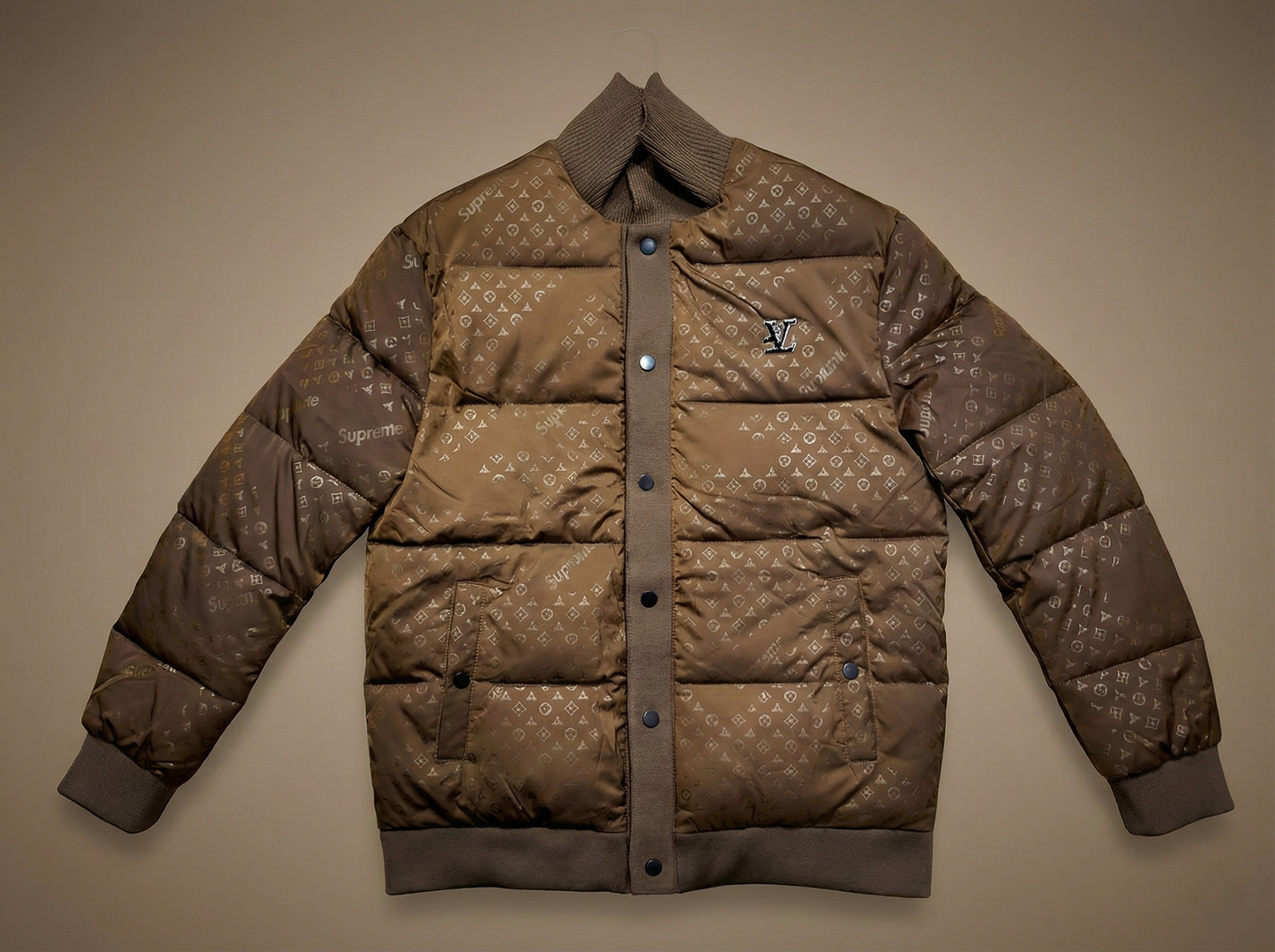 Brown puffer jacket with a brand logo on a beige background