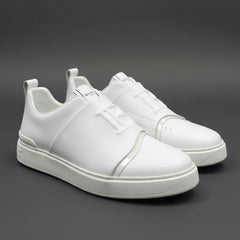 White sneakers on a dark gray background