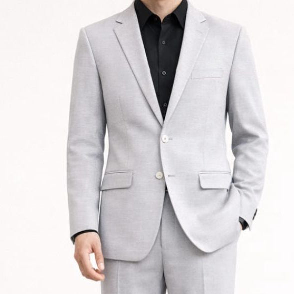 Light gray suit with a black shirt on a white background