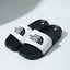 Black and white slides with The North Face logo on a light gray background