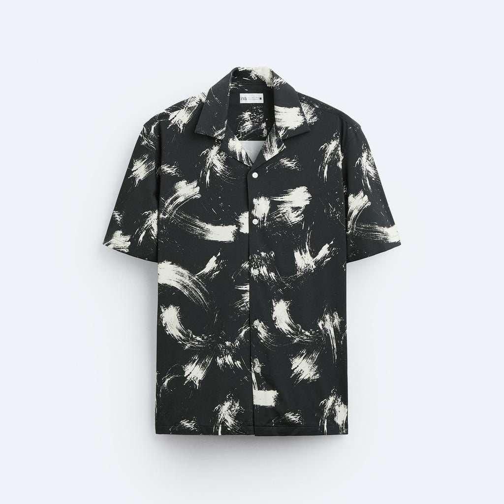Black and white patterned shirt on a light gray background