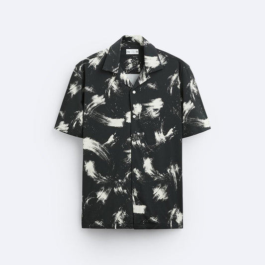 Black and white patterned shirt on a light gray background