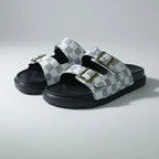 Pair of checkered sandals on a light gray background