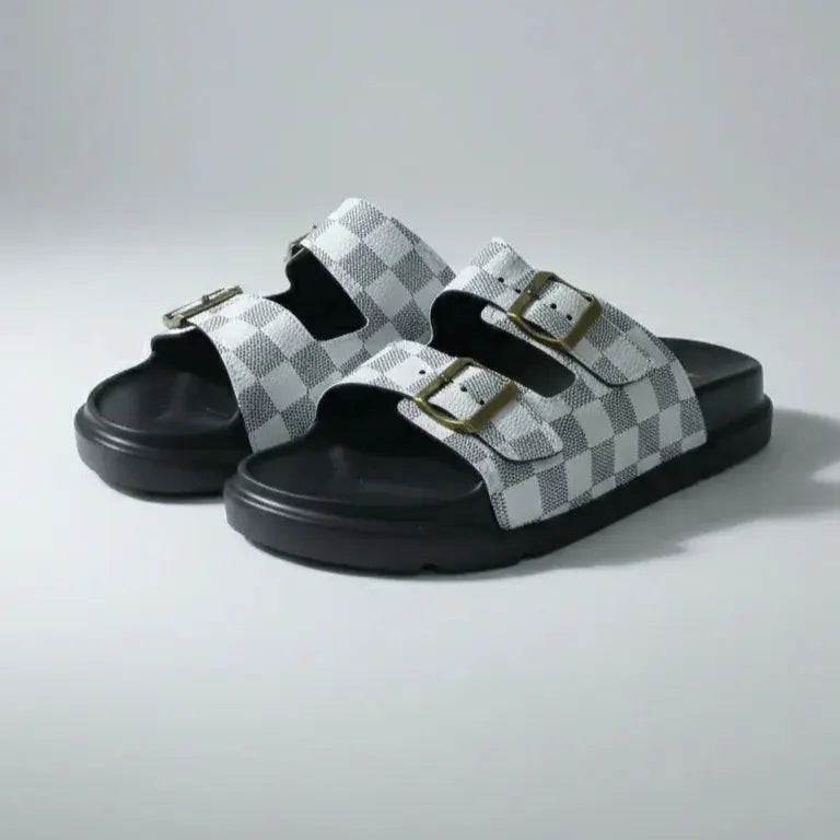 Pair of checkered sandals on a light gray background