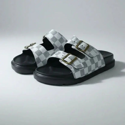 Pair of checkered sandals on a light gray background
