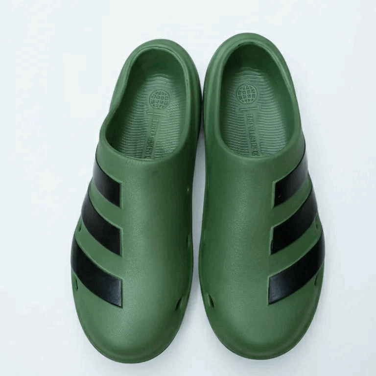 Green shoes with black stripes on a white background