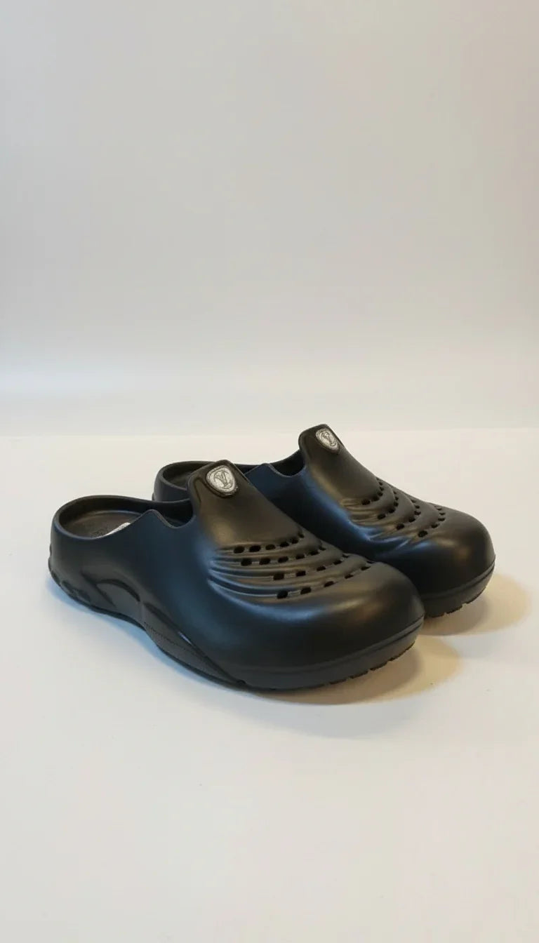 Pair of black clogs on a white background