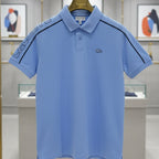 Blue polo shirt on a hanger in a store setting