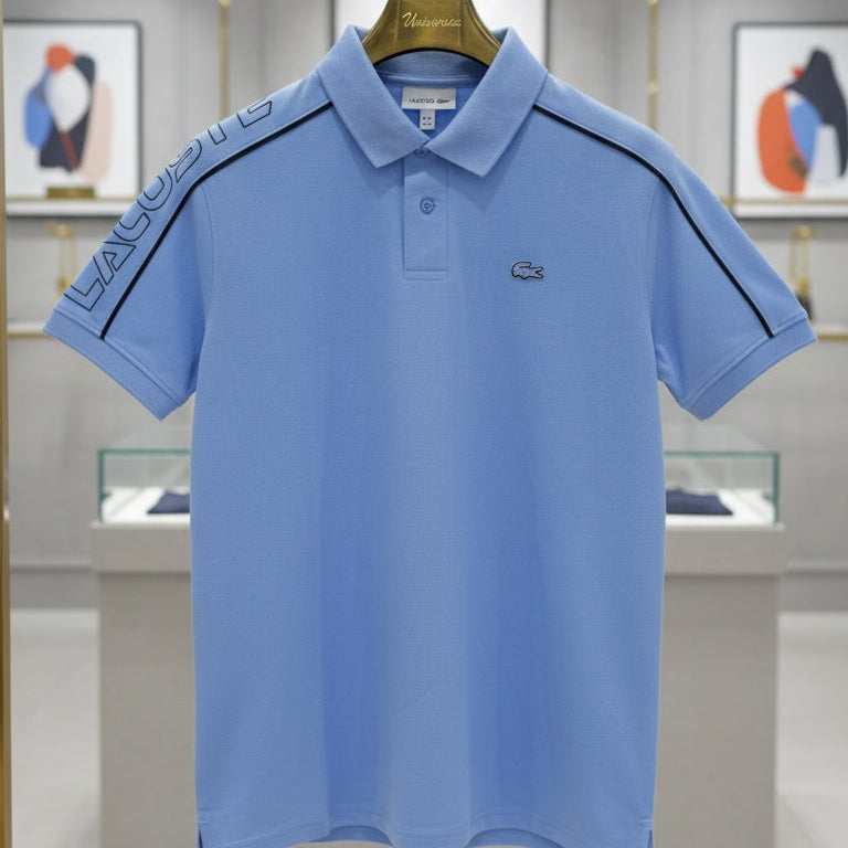 Blue polo shirt on a hanger in a store setting