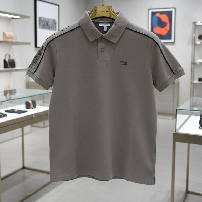 Gray polo shirt on a hanger in a store setting