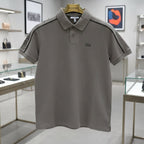 Gray polo shirt on a hanger in a store setting