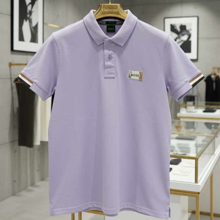 Light purple polo shirt on a hanger in a store setting Main image
