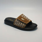 Dior slide sandal with brown strap on a gray background