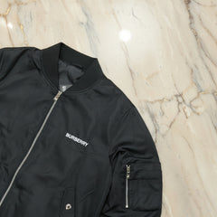 Black Burberry jacket on a marble surface