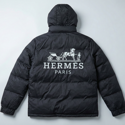 Black puffer jacket with Hermes Paris logo on a light gray background