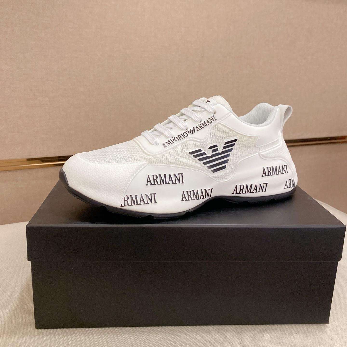 White Armani sneaker on a black box with a beige background
