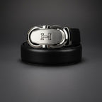 Black leather belt with a silver buckle on a dark gray background