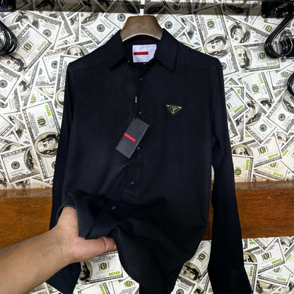 Black shirt on a hanger with a Prada tag against a background of dollar bills and 'UNIVERSES' text.