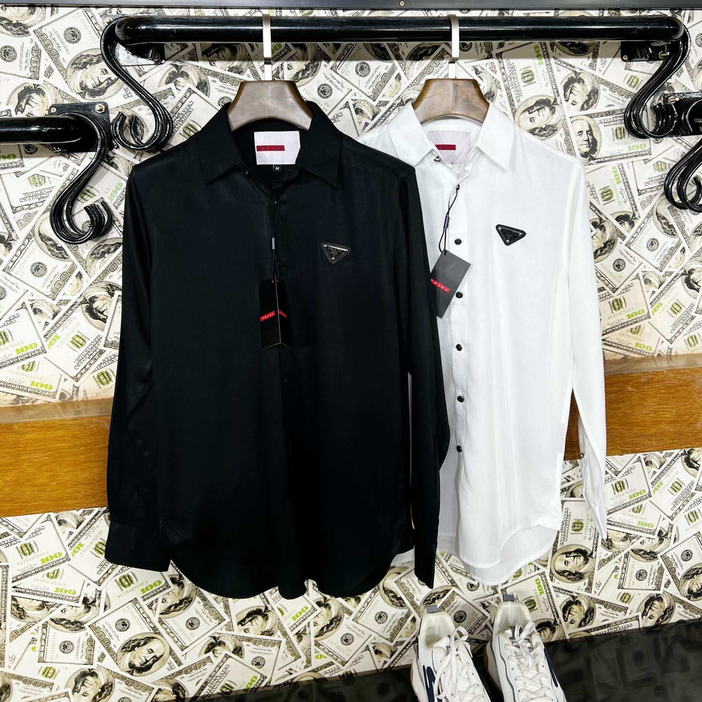 Black and white shirts hanging on a rack with a decorative background featuring money and 'UNIVERSES' text.
