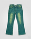 Green denim jeans on a light gray background