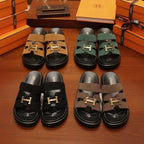 Set of four sandals in different colors with 'H' logo on a wooden surface, surrounded by orange boxes.