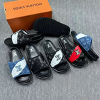 Louis Vuitton slides with various color combinations on a gray surface.