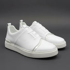 White sneakers on a dark gray background