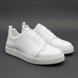 White sneakers on a dark gray background