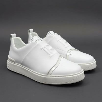 White sneakers on a dark gray background