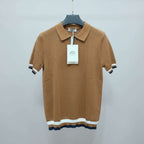 Brown knitted polo shirt with a tag on a hanger in a store setting