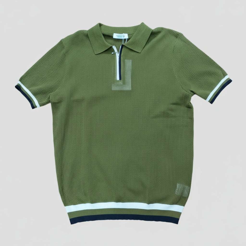 Green polo shirt with white and black trim on a light gray background Main image