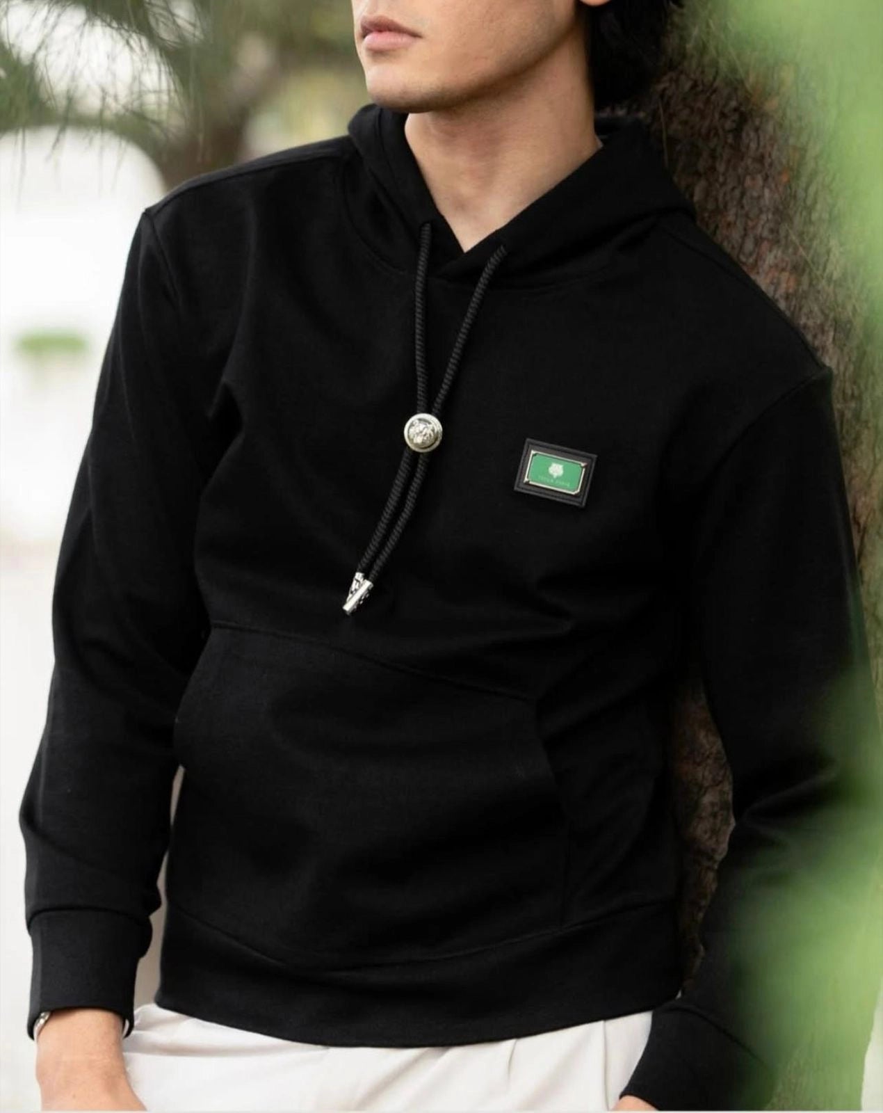 Onyx Black Tech-Luxe Hoodie with Signature Bolo Detail Main image