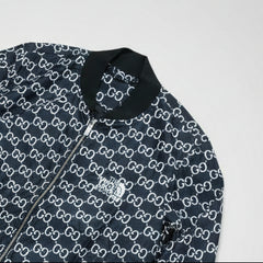 Navy jacket with white pattern on a wooden surface