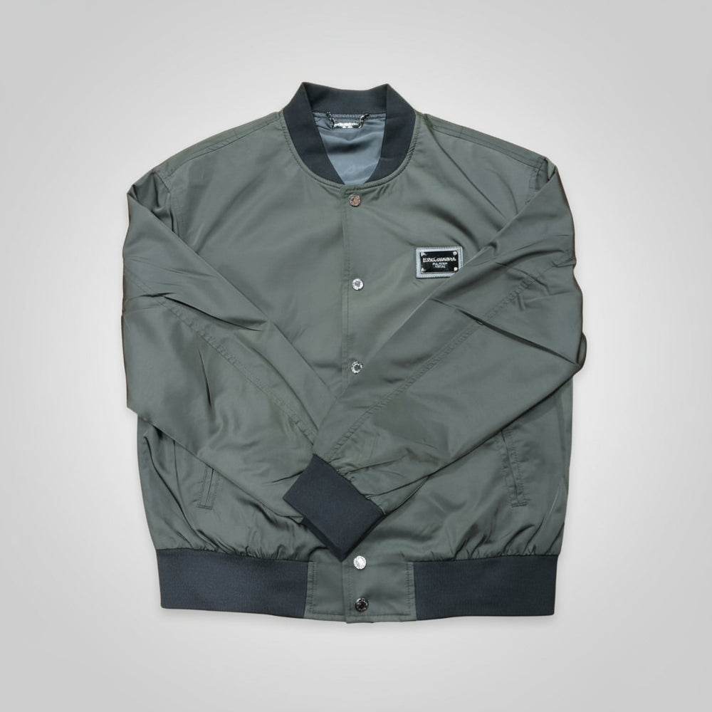 Green bomber jacket with black accents on a white background