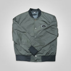 Green bomber jacket with black accents on a white background