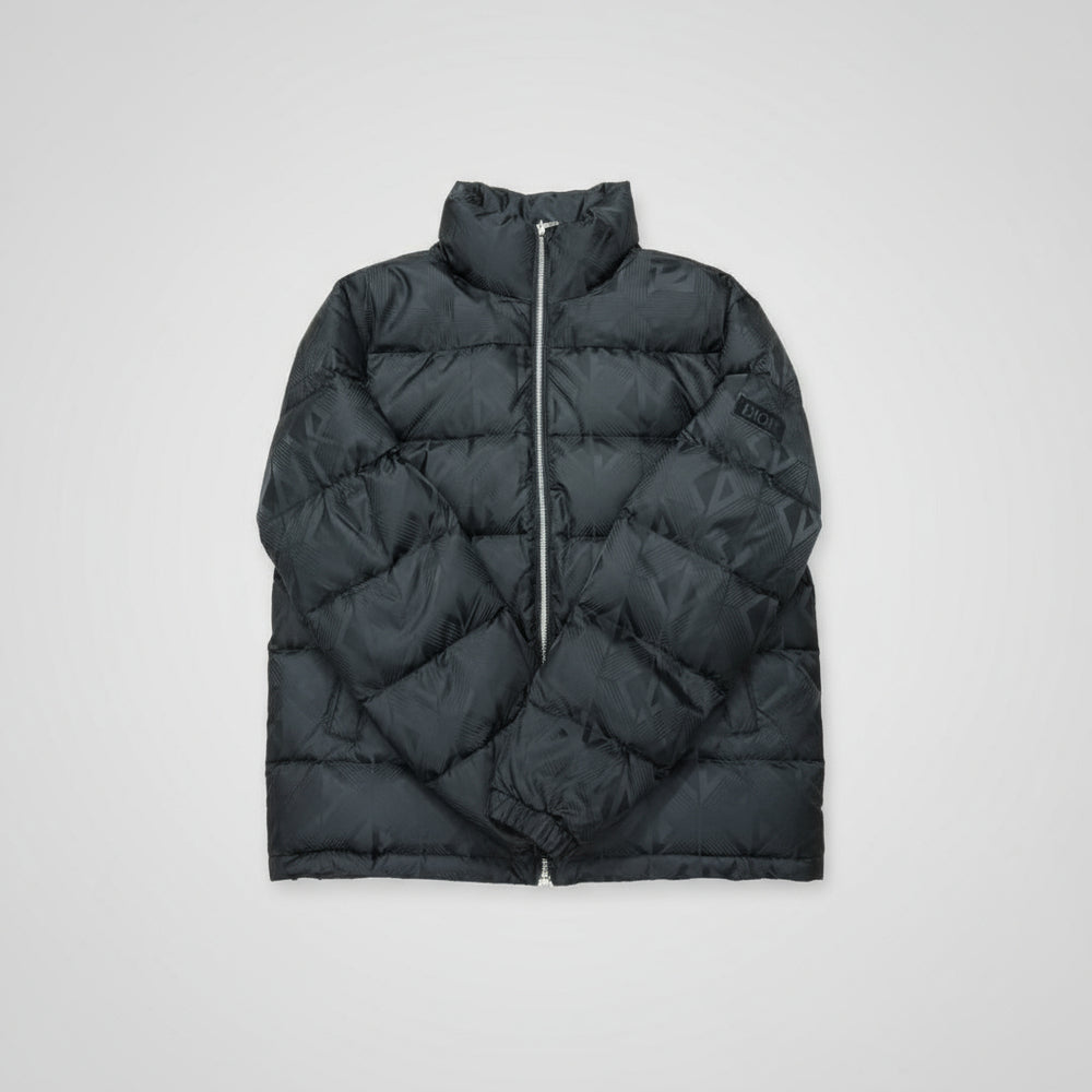 Black puffer vest on a wooden surface